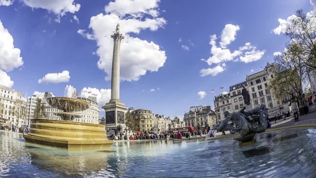 Time lapse fish eye view of Trafalgar square in London with fountains, admiral Nelson column, car traffic