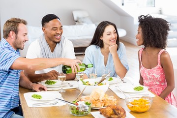 Obraz na płótnie Canvas Friends interacting while having a meal