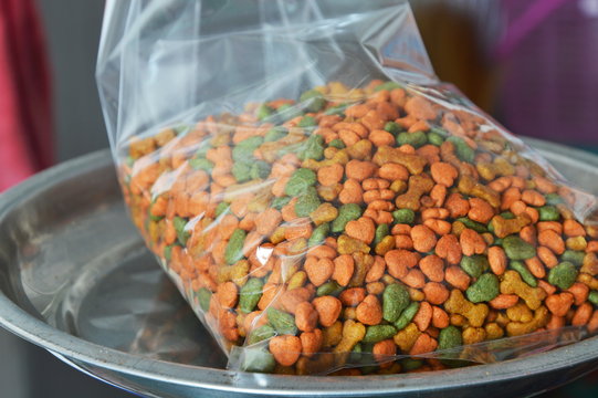 dog food in plastic bag for packing on weighing scale
