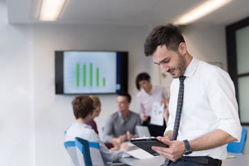 young business man with tablet at office meeting room