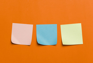 Reminder sticky notes on red background
