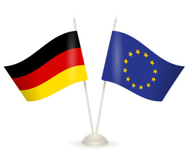 Table stand with flags of Germany and US. 