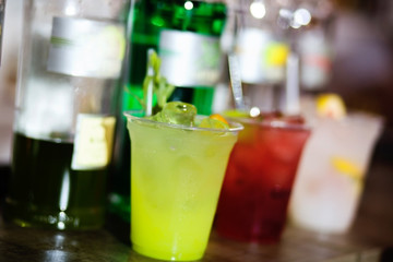 green cocktail on a bar