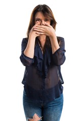 Young girl covering her mouth