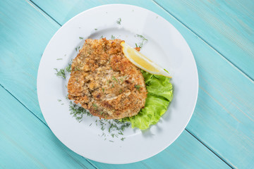 restaurant menu, fish fillet in breadcrumbs, Top view