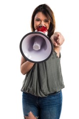 Young girl shouting by megaphone