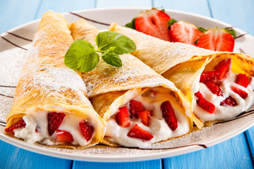 Crepes with strawberries and cream