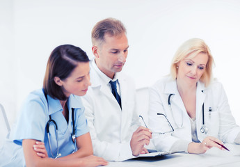 team or group of doctors on meeting