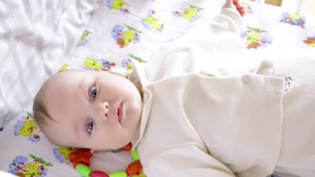 newborn baby girl boy sneezing smiling and stretching while waking up