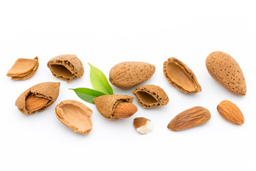 Almonds with leaves isolated on white background
