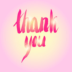 thanks written by hand on a pink shimmering background