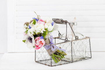 Beautifull spring bouquet in rustic style basket