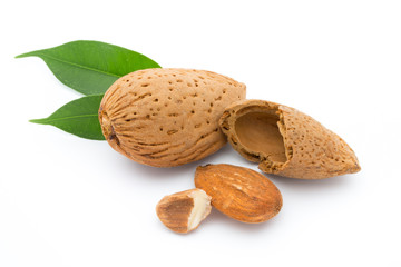 Almonds with leaves isolated on white background