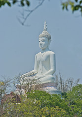 A statue of a Buddha on mountain in Thailand