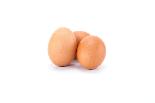 Three raw fresh eggs on white background.