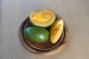 Cut mango on board.