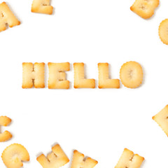 hello message written with homemade biscuits, on white background