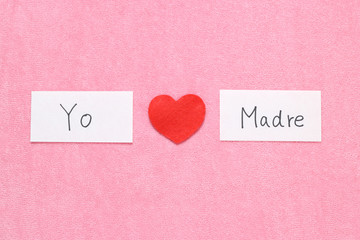 I Love Mom concept in Spanish. 
Red heart and hand written letters spelling I Love mom concept in Spanish.