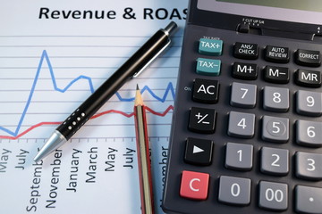 Eye Glasses, pen and pencil over the Formula with calculator