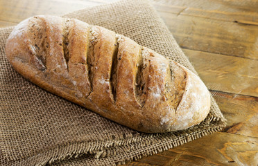 Crusty cereal bread in a rustic composition