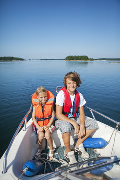 Boy and girl sitting in boat