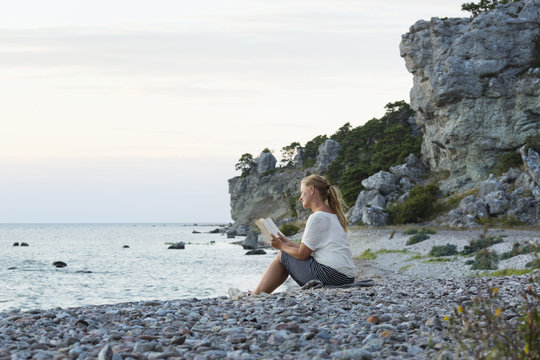 Woman reading on beach