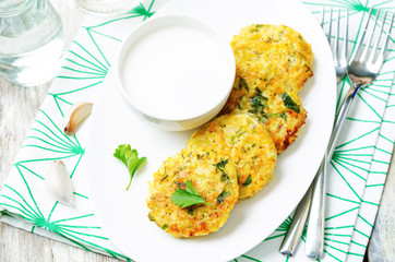 Cheesy millet zucchini fritters