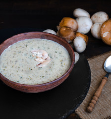 Mushroom cream soup on the table, rustic style