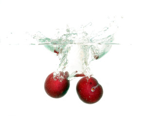 Water splash / Water splash and sherry on white background.