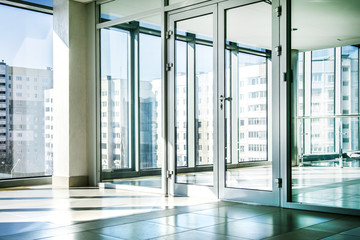 Office with glass wall and sunny weather