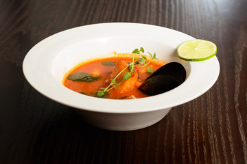 salmon soup with vegetables close up