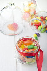 Multicolor candies in glass jars