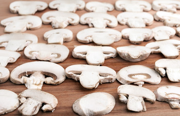 Champignon on wooden background