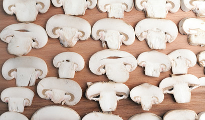Champignon on wooden background