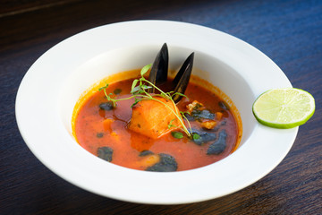 salmon soup with vegetables close up