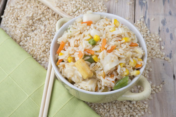 Rice with vegetables on white background