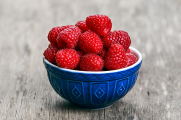 Fresh raspberries in bowl. concept for healthy eating