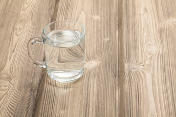 glass of water on a wooden table