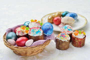 Easter still life in wicker baskets. Easter cakes. Easter colore
