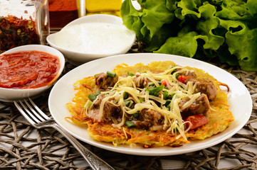 Potato pancake with goulash.