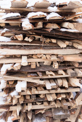 firewood in the snow in the winter