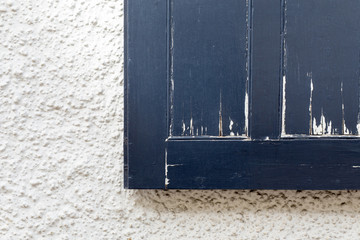 Old Blue Peeling Paint Vintage Window Shutter on White Wall