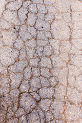 cracks in the old pavement as a background
