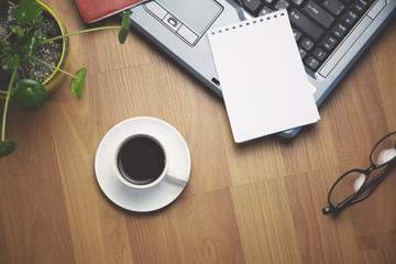 notebook,notepad,coffee,glasses on table