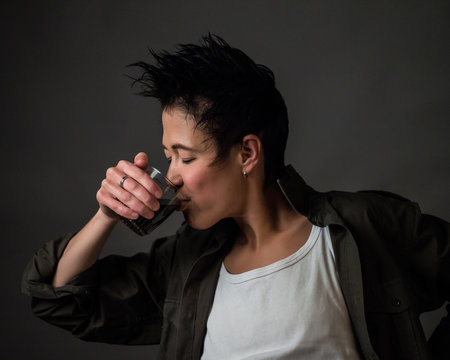 Androgynous character on a gray background. Man or woman. Military style.