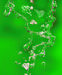 splashes of water on a green background