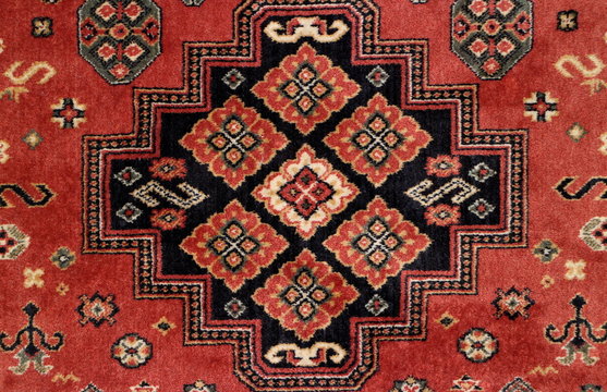 geometric  pattern old Persian carpet closeup