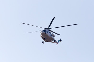 Fototapeta na wymiar helicopter on a blue sky