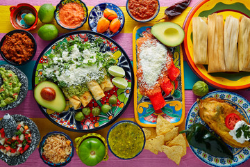 Green and red enchiladas with mexican sauces