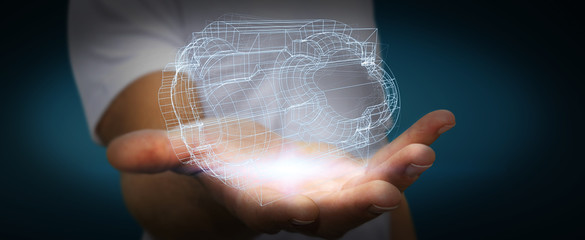 Businessman holding digital 3D engine